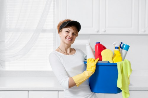 Professional carpet cleaner preparing equipment for a service appointment